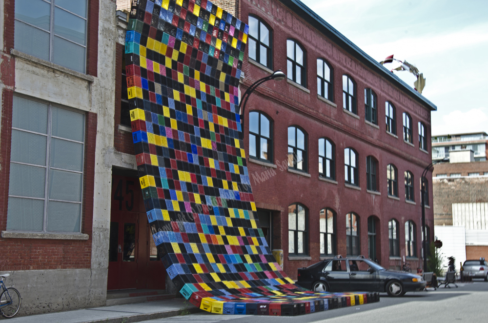 Montreal,Multicolored Milk Crate sculpure  cascading from building,Quebec, Canada