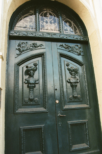 Green doors with reliefs in Valparaiso, Chile 2012-6834-31