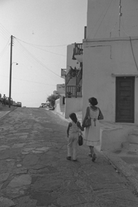 Mykonos, Greece, Black and White photograph by Maria Savidis of a girl and her grandmother