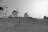 Black and White photograph by Maria Savidis of Mykonos, Greece and its iconic windmills